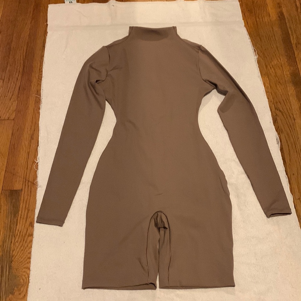 NWT Skims ALL-IN-ONE LONG SLEEVE MID THIGH ONESIE